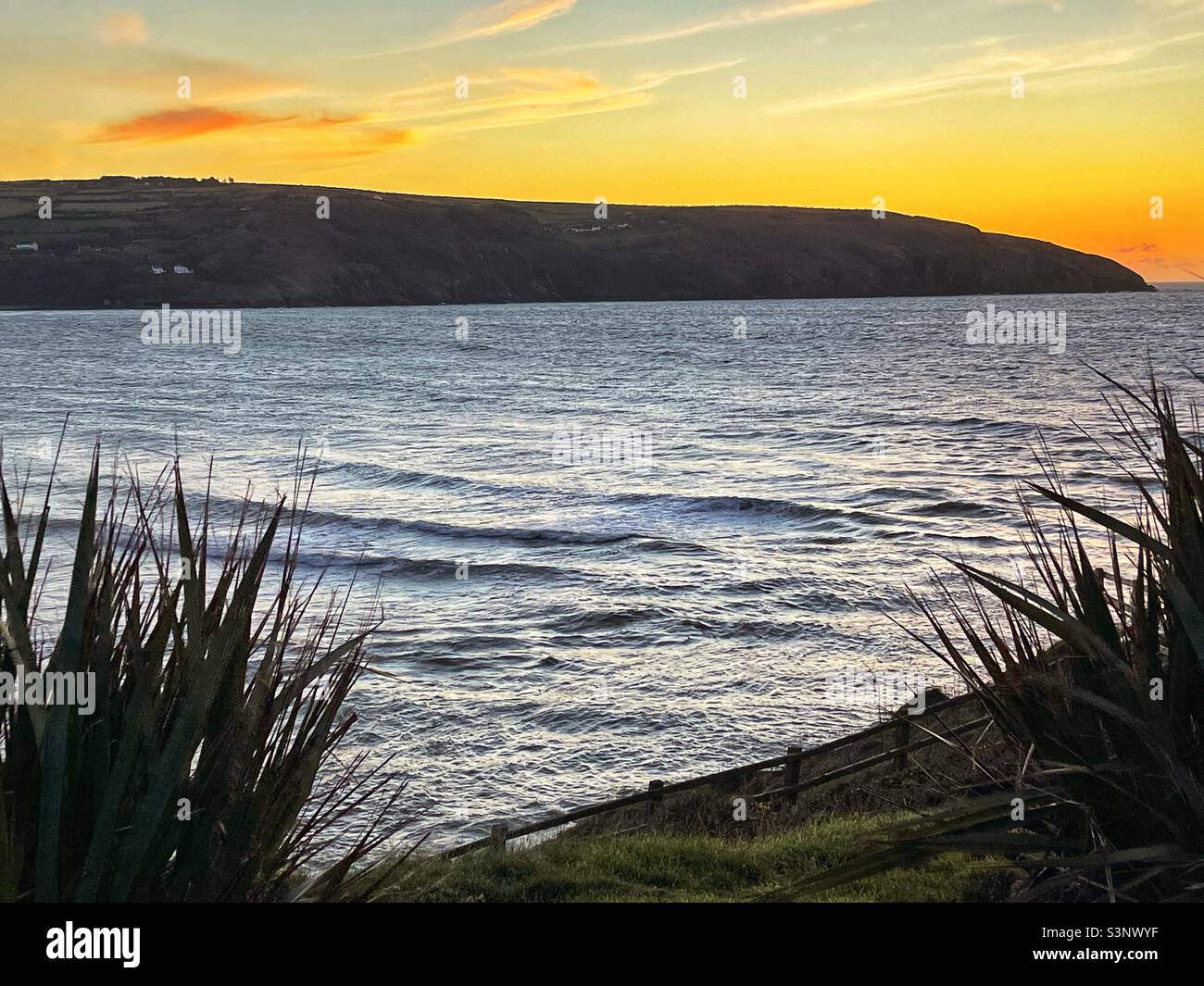 Coastal scene at sunset Stock Photo