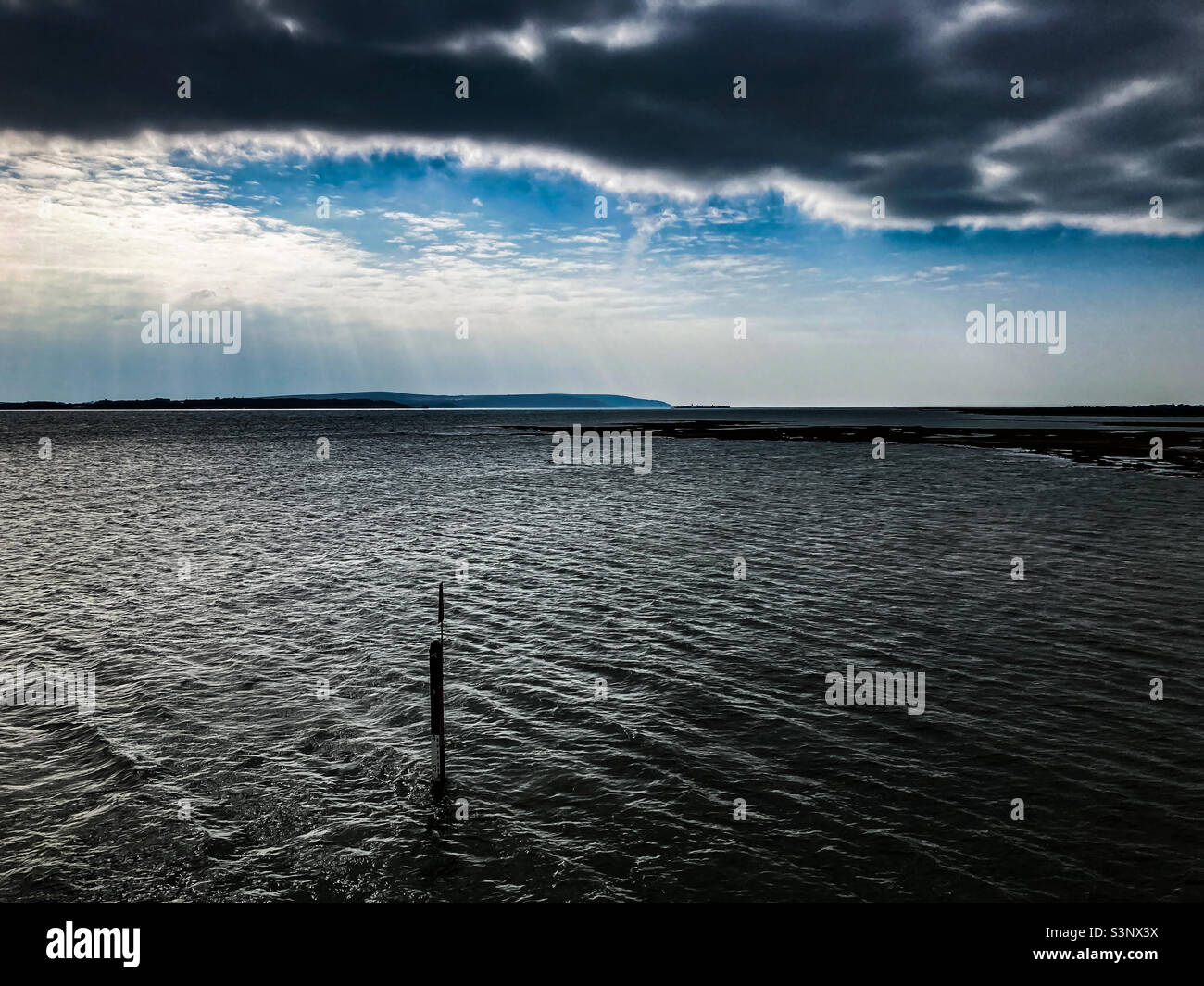 Dramatic seascape with blue sky and clouds Stock Photo - Alamy