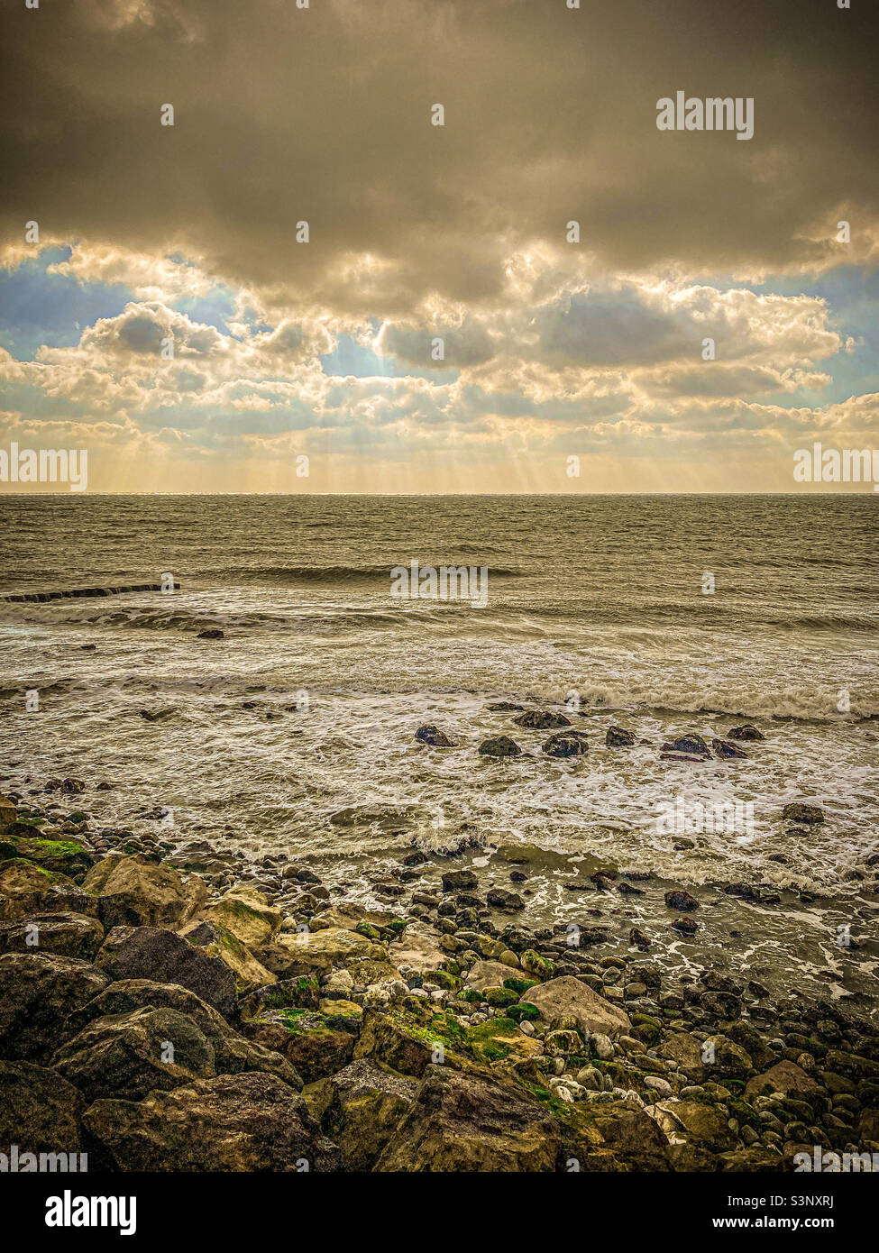 Rocky shoreline with clouds - Smartphone Captured Stock Image