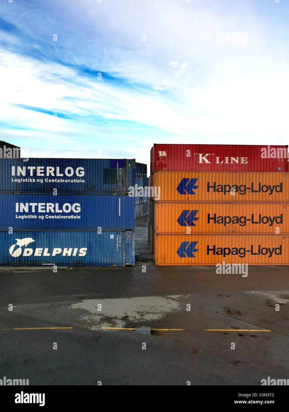 shipping containers stacked up in depot Stock Photo