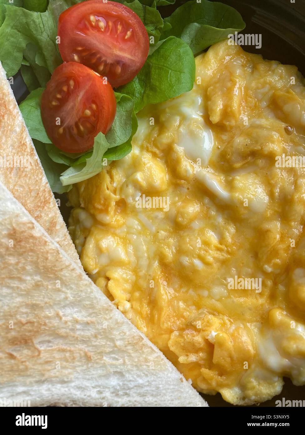 Cheese omlet with toast on the side Stock Photo