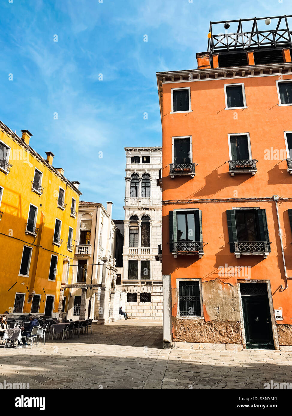 Vibrant houses in residential neighbourhood in Venice, Italy on a sunny February day in 2022. - Smartphone Captured Stock Image