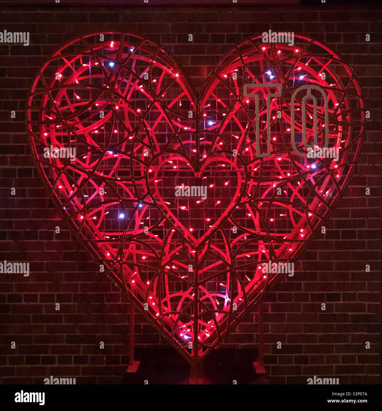 A brightly lit red heart. - Smartphone Captured Stock Image