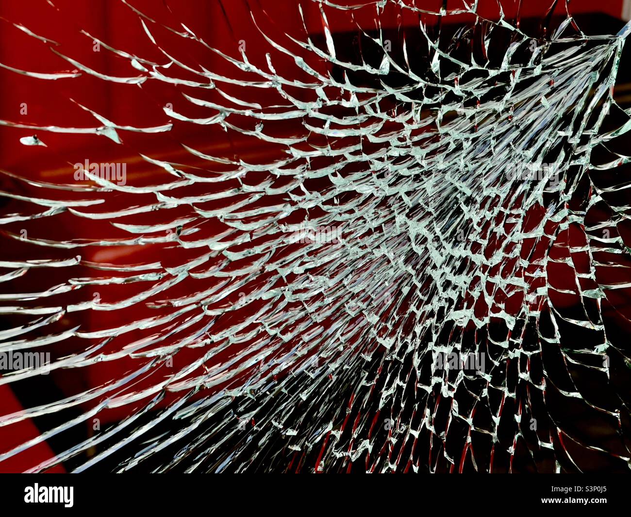 A shattered window pane In Angel Street, Worcester UK - Smartphone Captured Stock Image