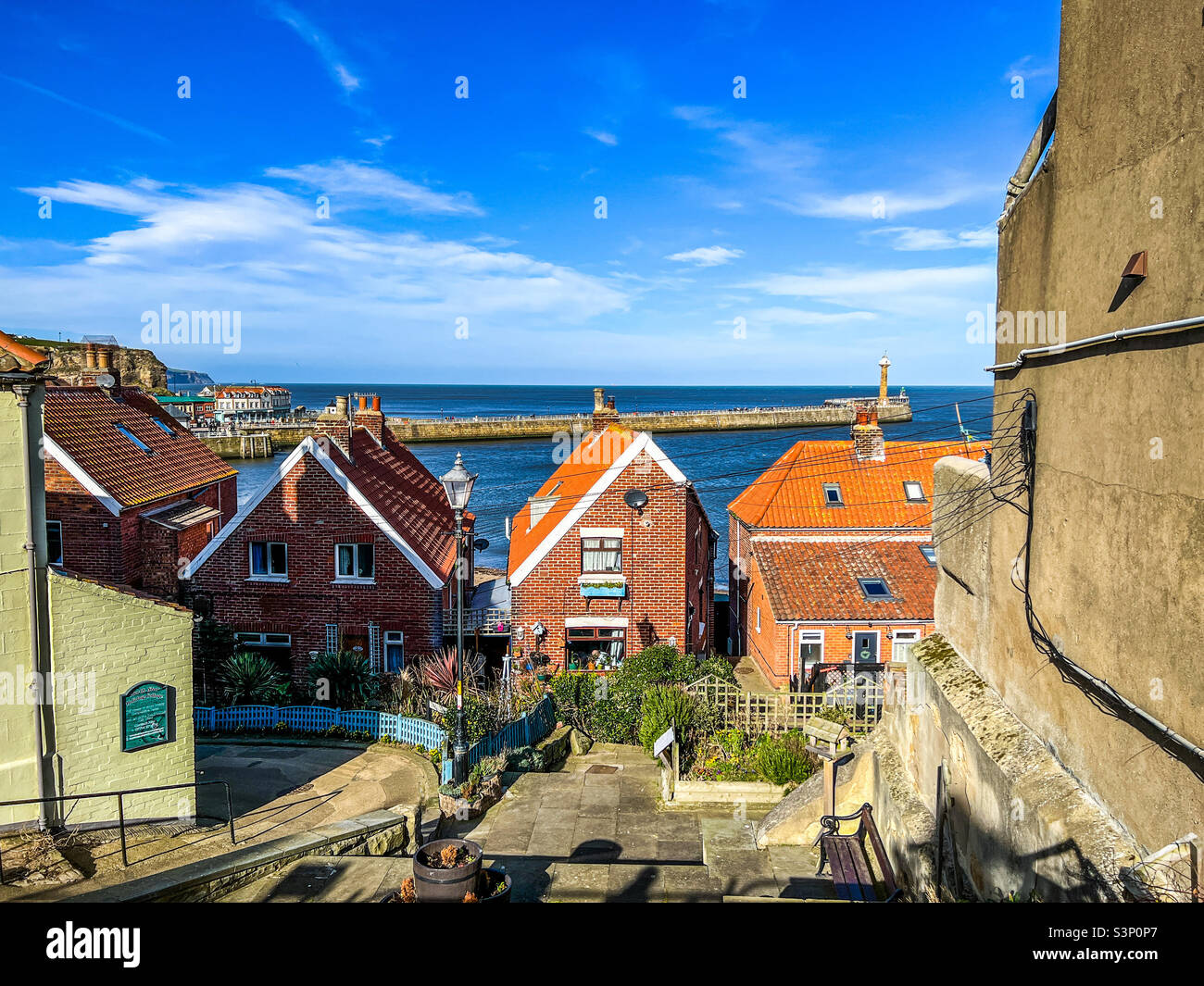 View of Whitby harbour and pier from 199 steps - Smartphone Captured Stock Image
