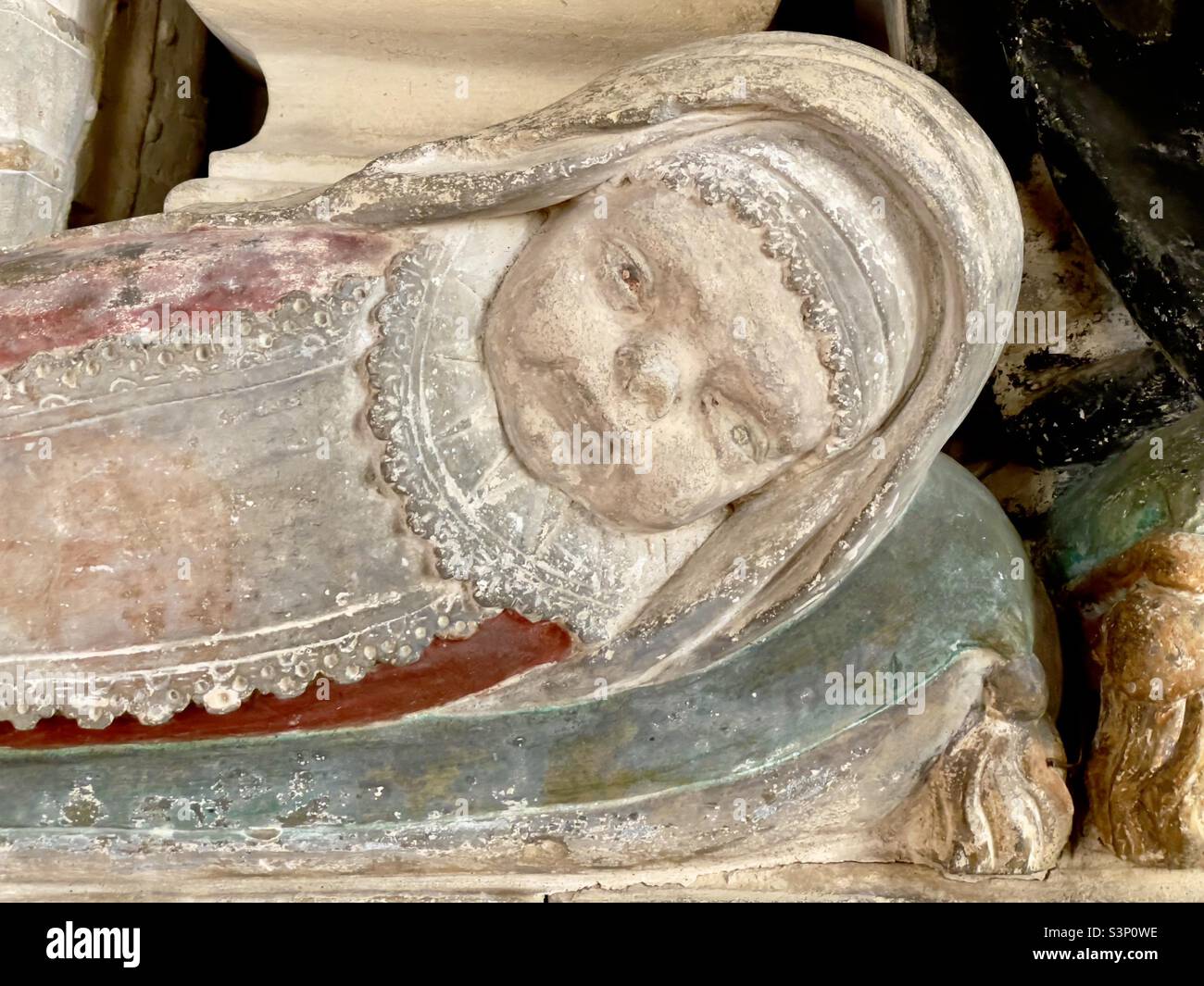 The figure of a swaddled baby, A detail of a monument to Sir Charles Percy in Dumbleton Church, Gloucestershire - Smartphone Captured Stock Image