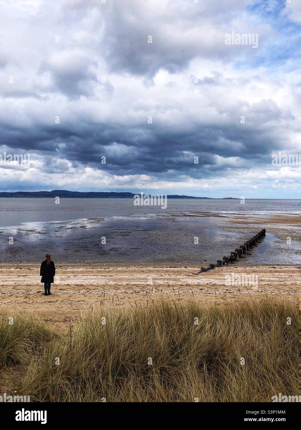 Standing on the beach looking out at the brooding sky - Smartphone Captured Stock Image