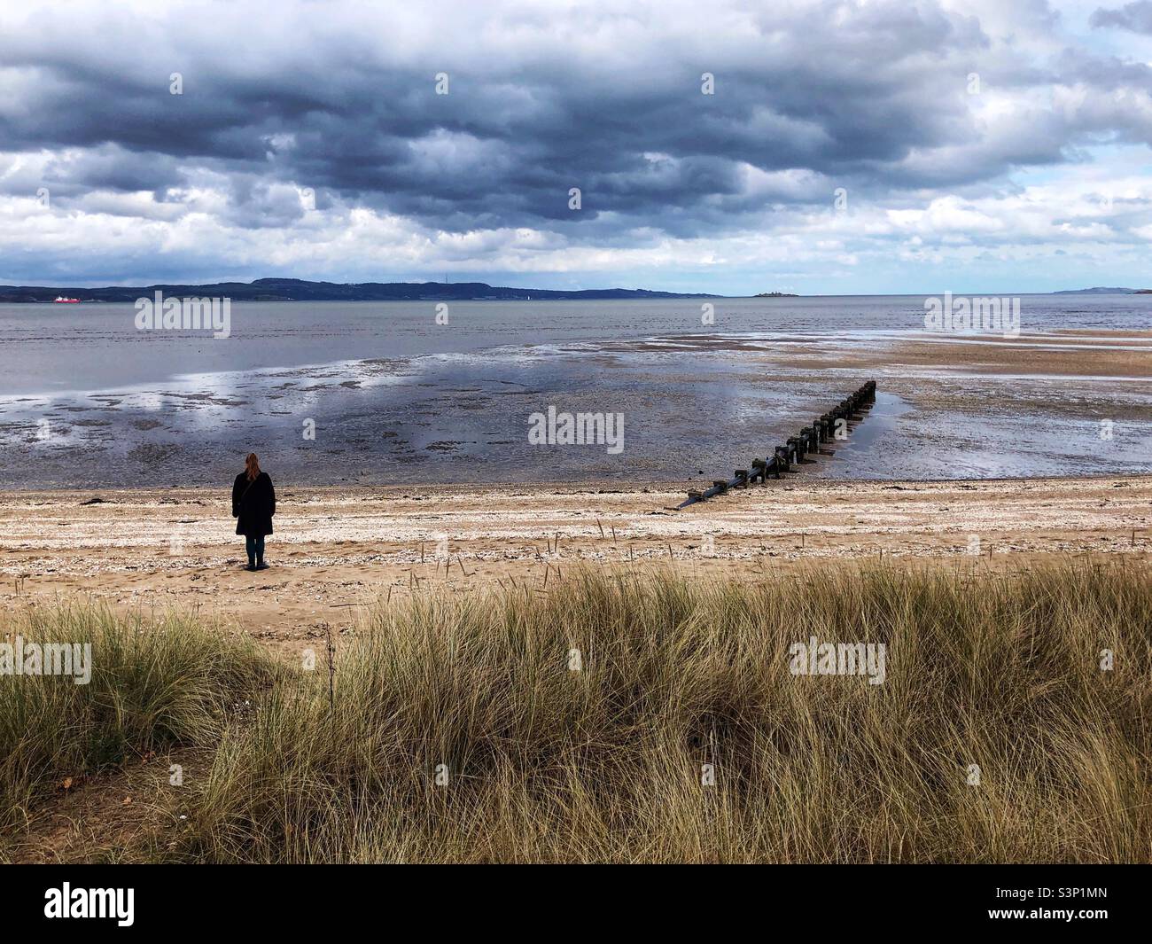 Standing on the beach looking out at the brooding sky - Smartphone Captured Stock Image