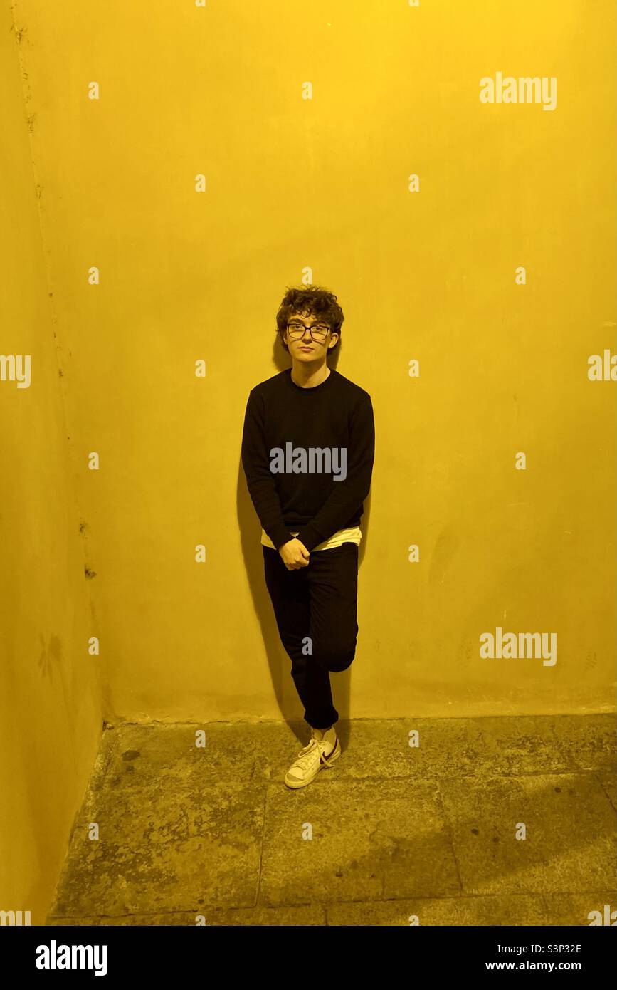 Black on yellow curly haired model. - Smartphone Captured Stock Image