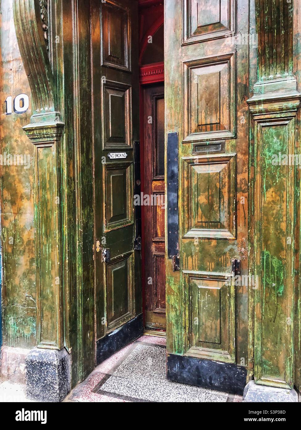 Peeling paint Exterior of an Old fashioned pub - Smartphone Captured Stock Image