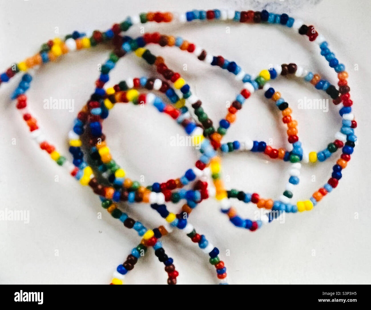 Strand of hippie era love beads - Smartphone Captured Stock Image