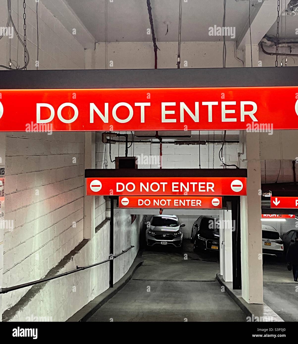 Do not enter signs on the out ramp at an underground parking garage in