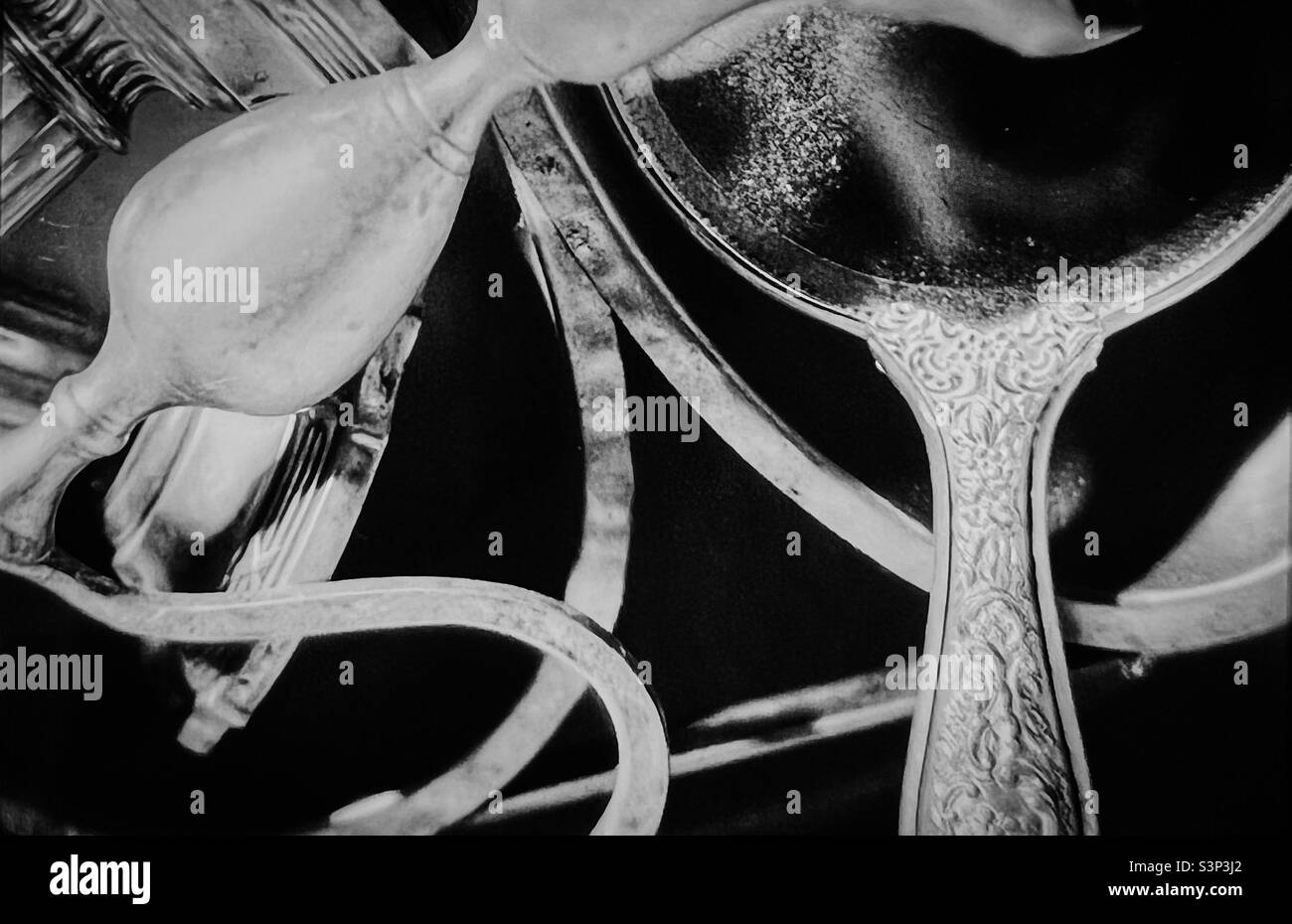 Antique Hand mirror and candlestick and silver items - Smartphone Captured Stock Image