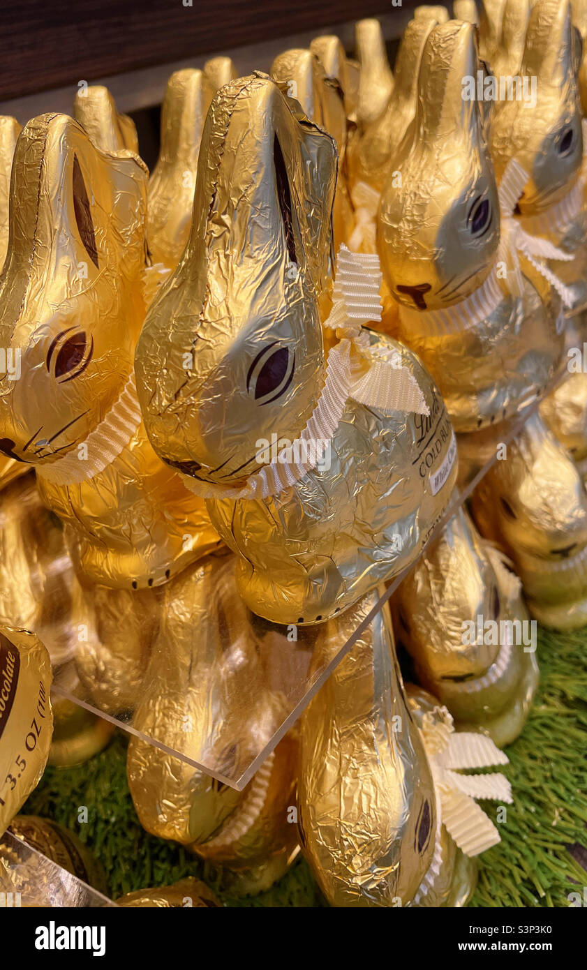 Gold foil wrapped Easter bunny display for sale in a retail outlet, 2022, USA Stock Photo