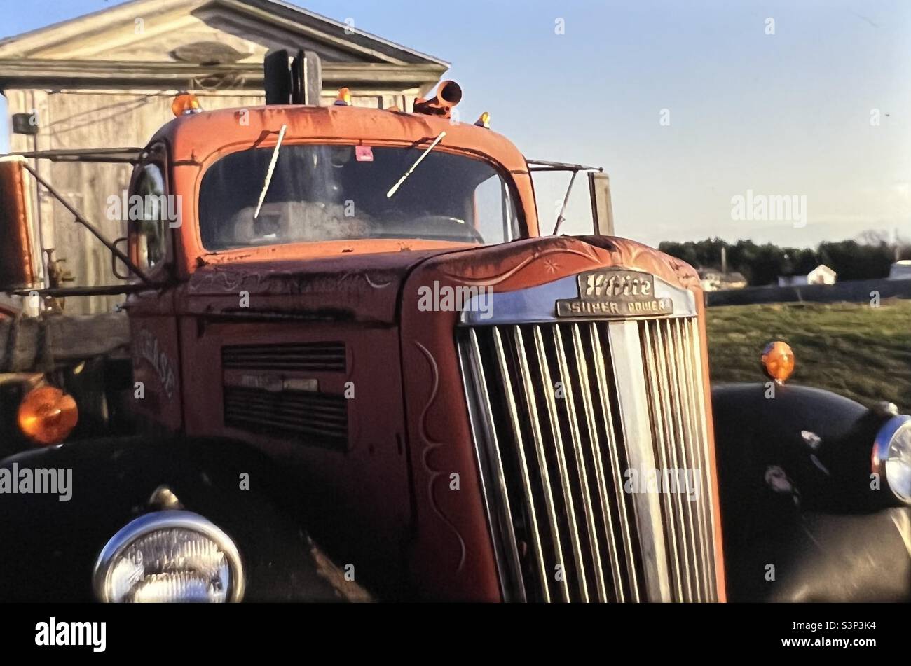 Barn being moved on old truck - Smartphone Captured Stock Image