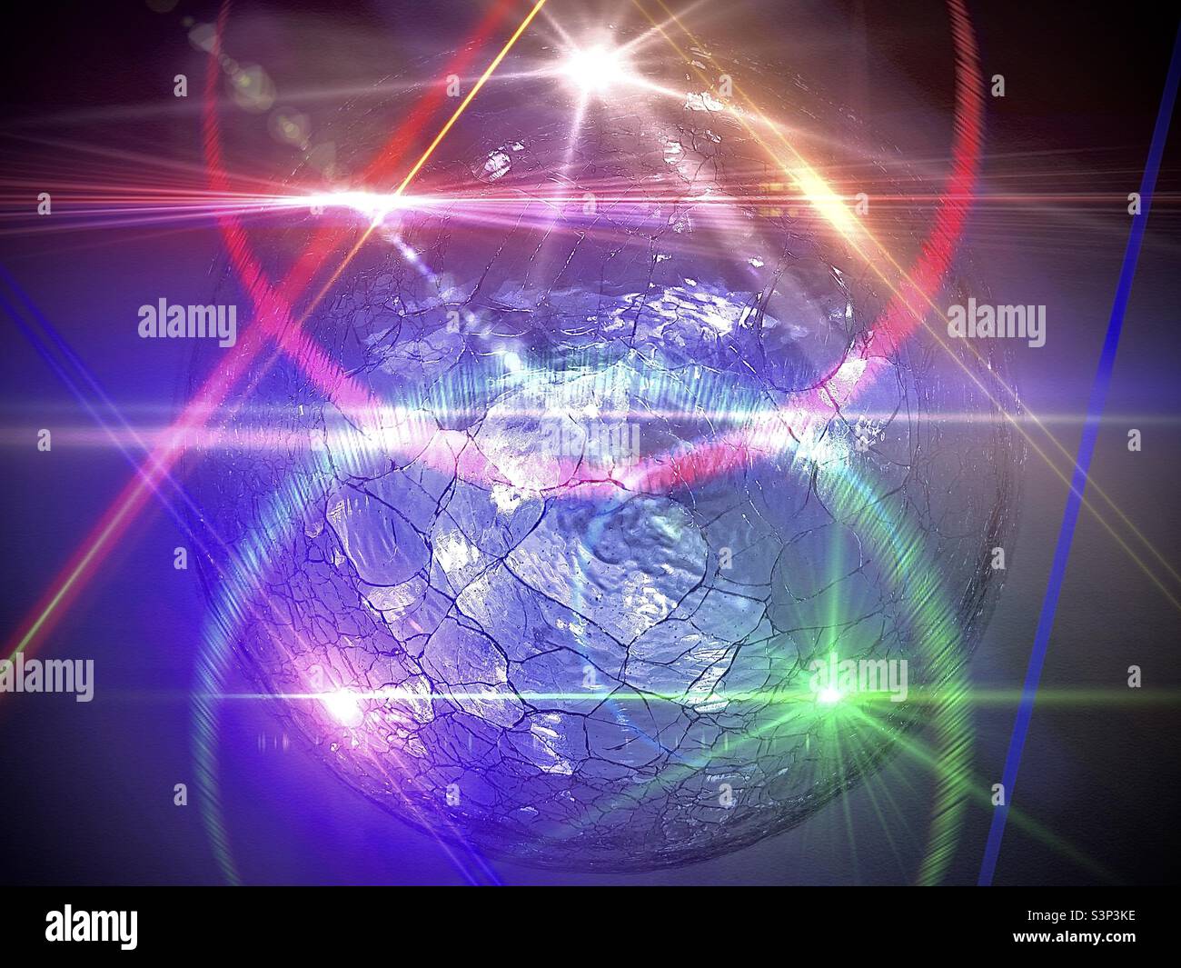 Cracked-glass lighted sphere, used as a home accent, was used as a source image, then a composite was created and lighting effects added via various IOS apps. - Smartphone Captured Stock Image