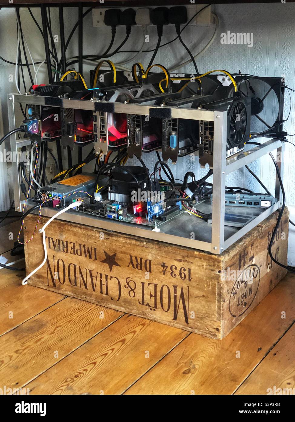 Bitcoin mining computer, an home built open frame pc mining crypto currency. Stock Photo
