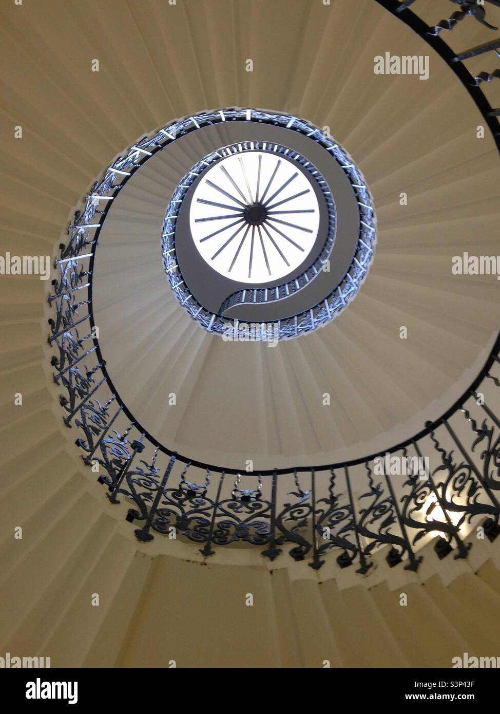 Spiral staircase at The Queens House in Greenwich taken from below. - Smartphone Captured Stock Image
