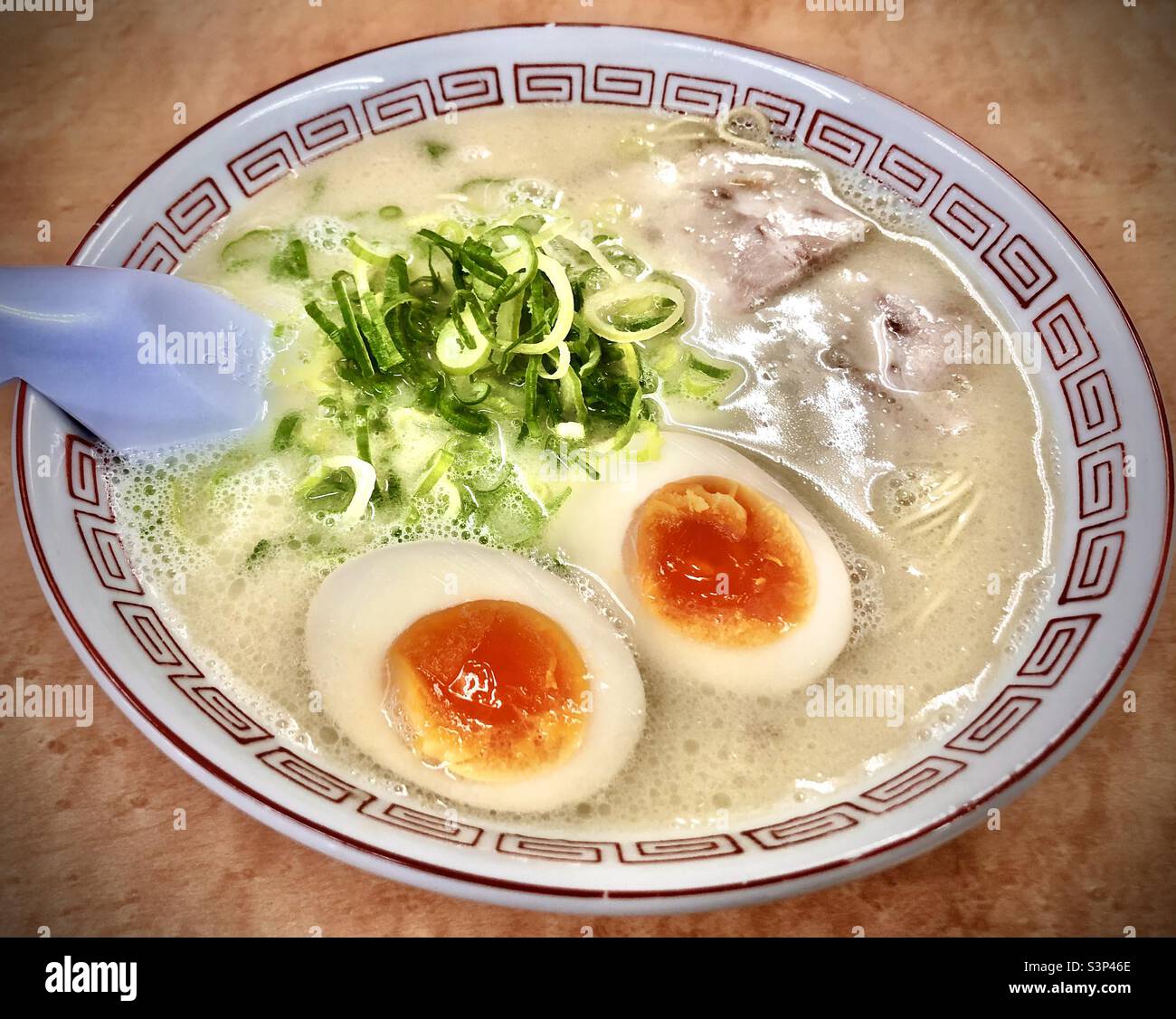 Hakata ramen, Hakata style ramen noodles in pork broth, with hanjuku soft boiled egg, green
