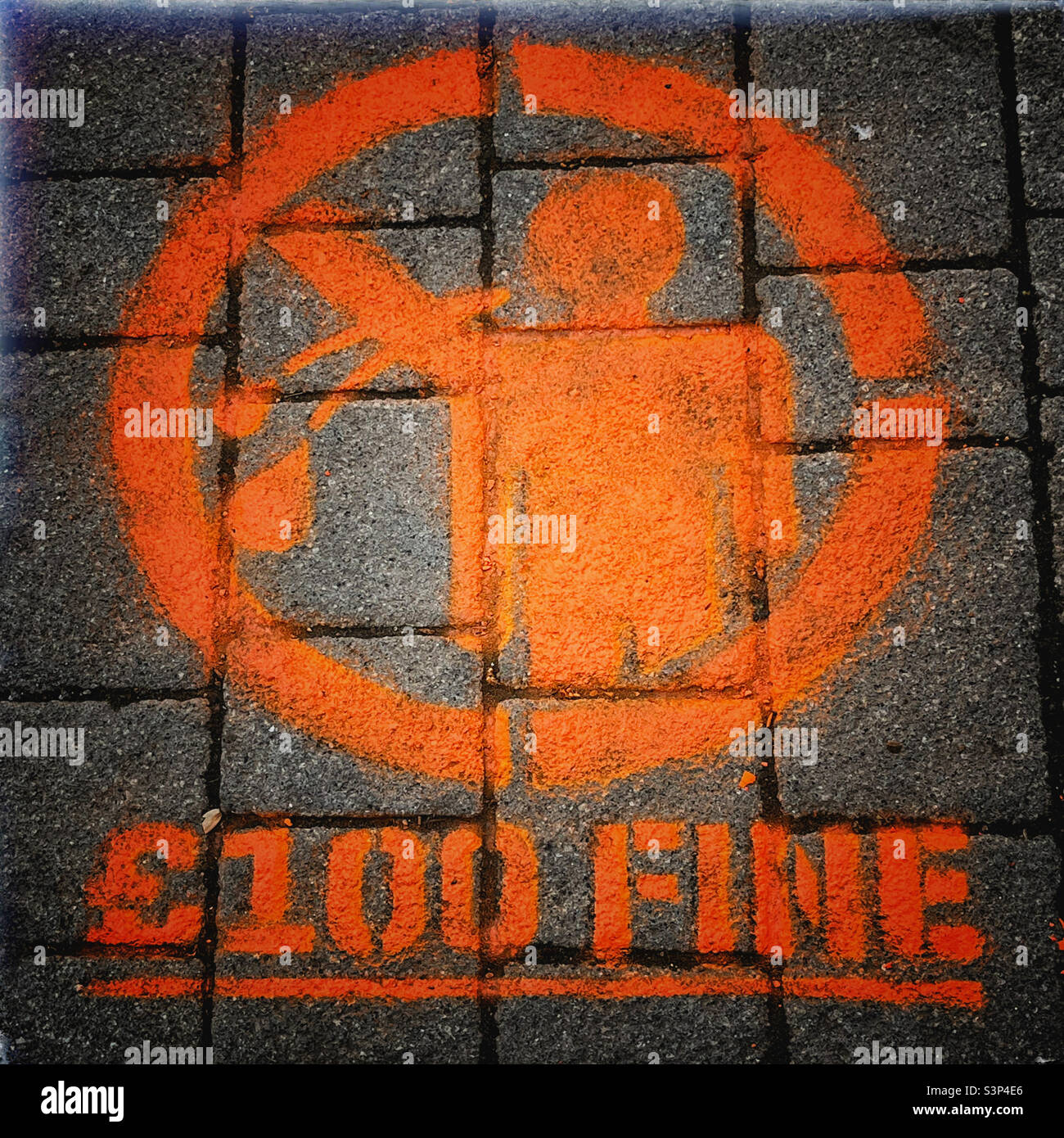 No spitting £100 fine - sign on pavement in Wembley, London - Smartphone Captured Stock Image