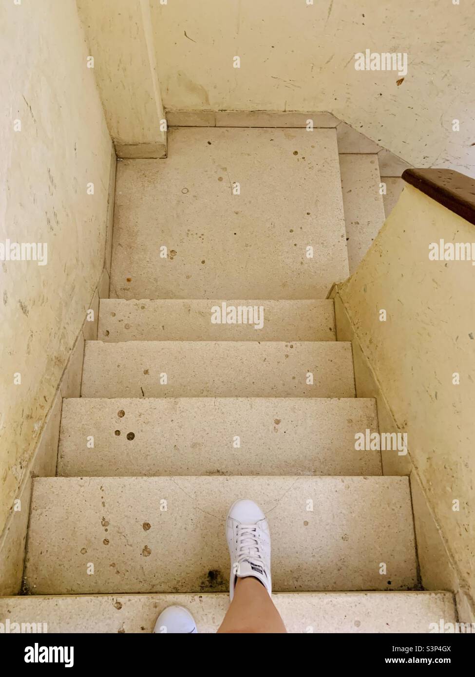 Going down the stairs of a building in Havana, Cuba. Havana in 2022 - Smartphone Captured Stock Image