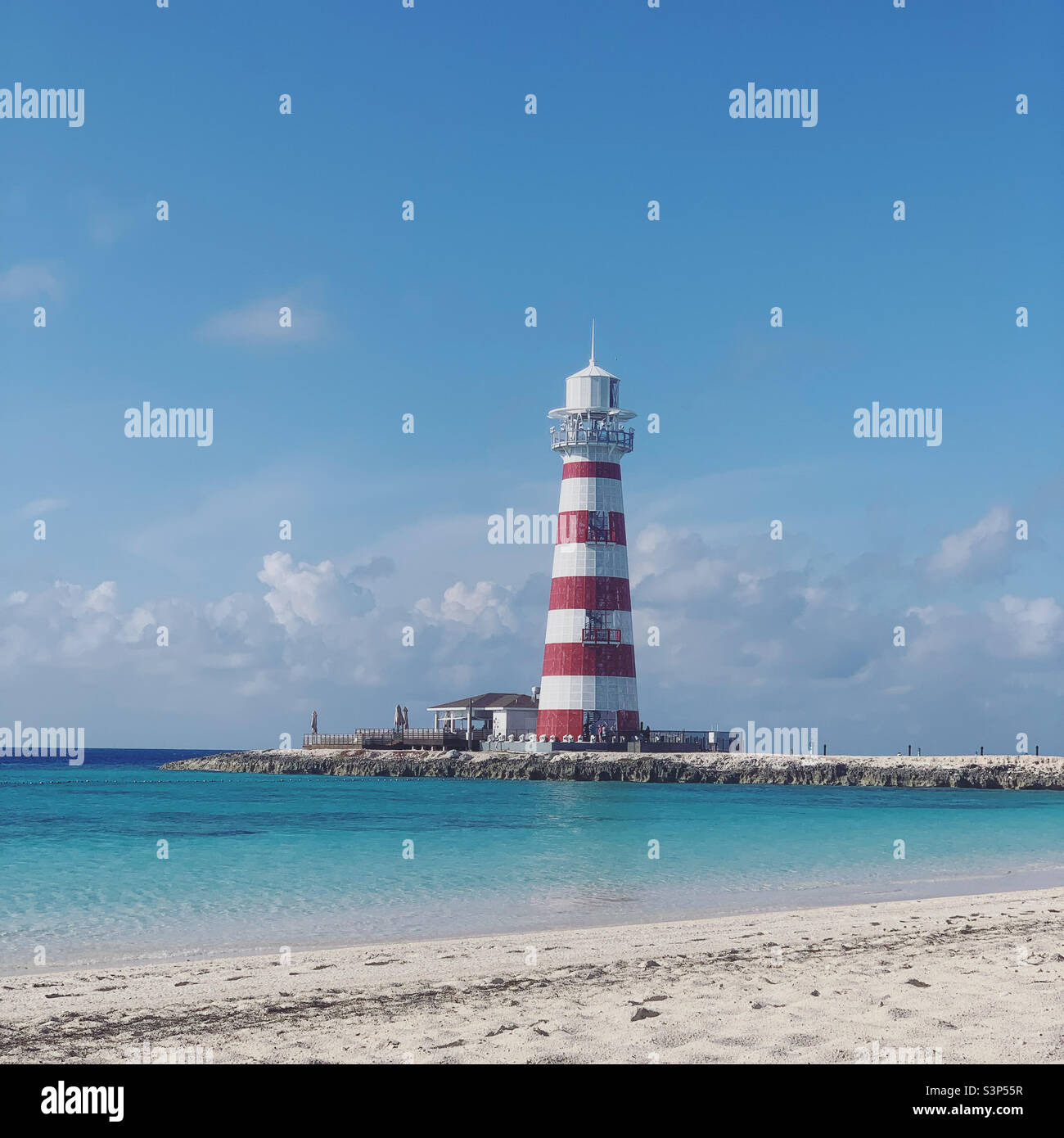 January, 2022, Beach and lighthouse on Ocean Cay, a private island owned by MSC cruiseline, seen during a cruise of the MSC Divina, from Miami, Florida, to the Bahamas - Smartphone Captured Stock Image