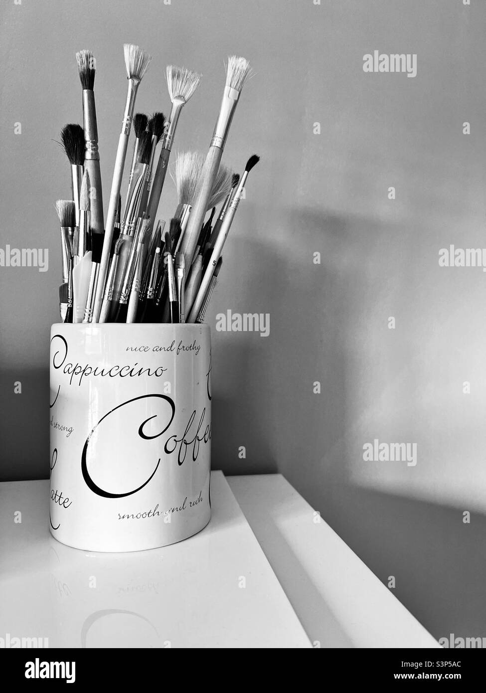 Artist’s paintbrushes in black and white Stock Photo