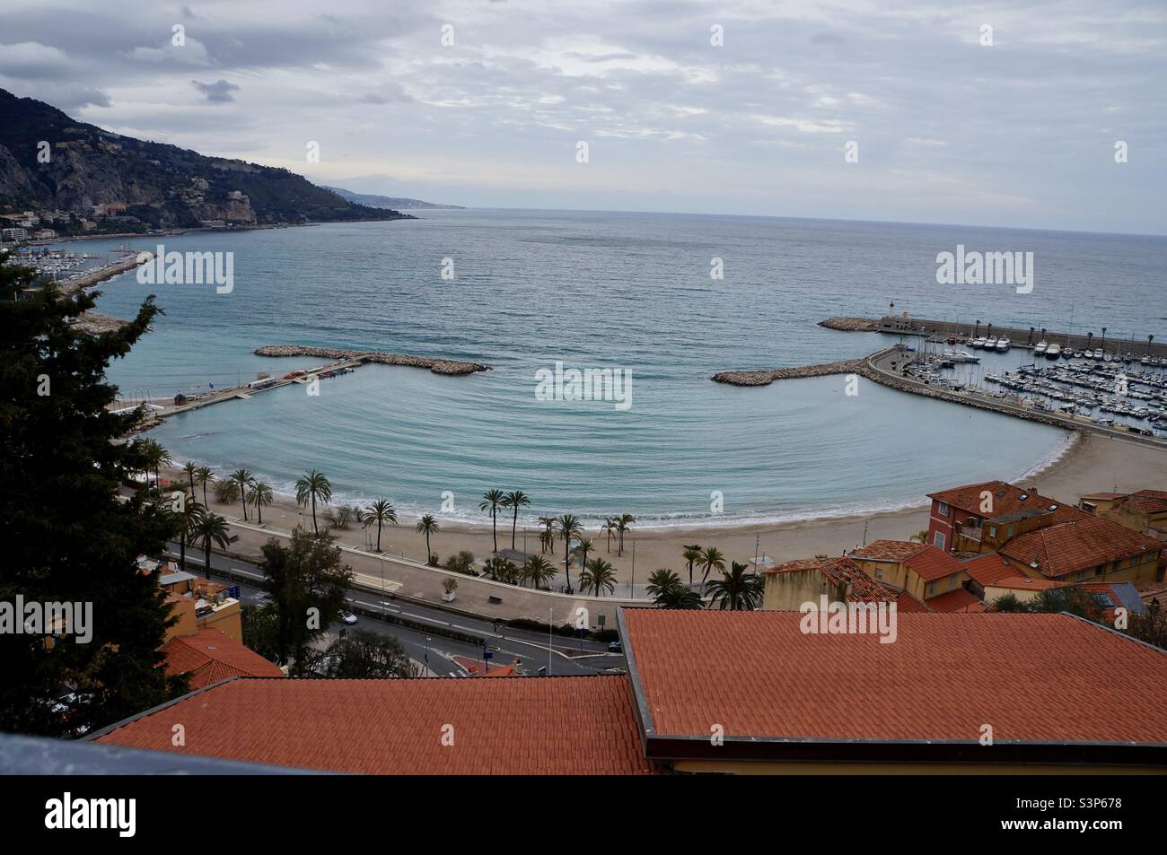 Plage des Sablettes in Menton France from up above on an overcast spring morning. - Smartphone Captured Stock Image