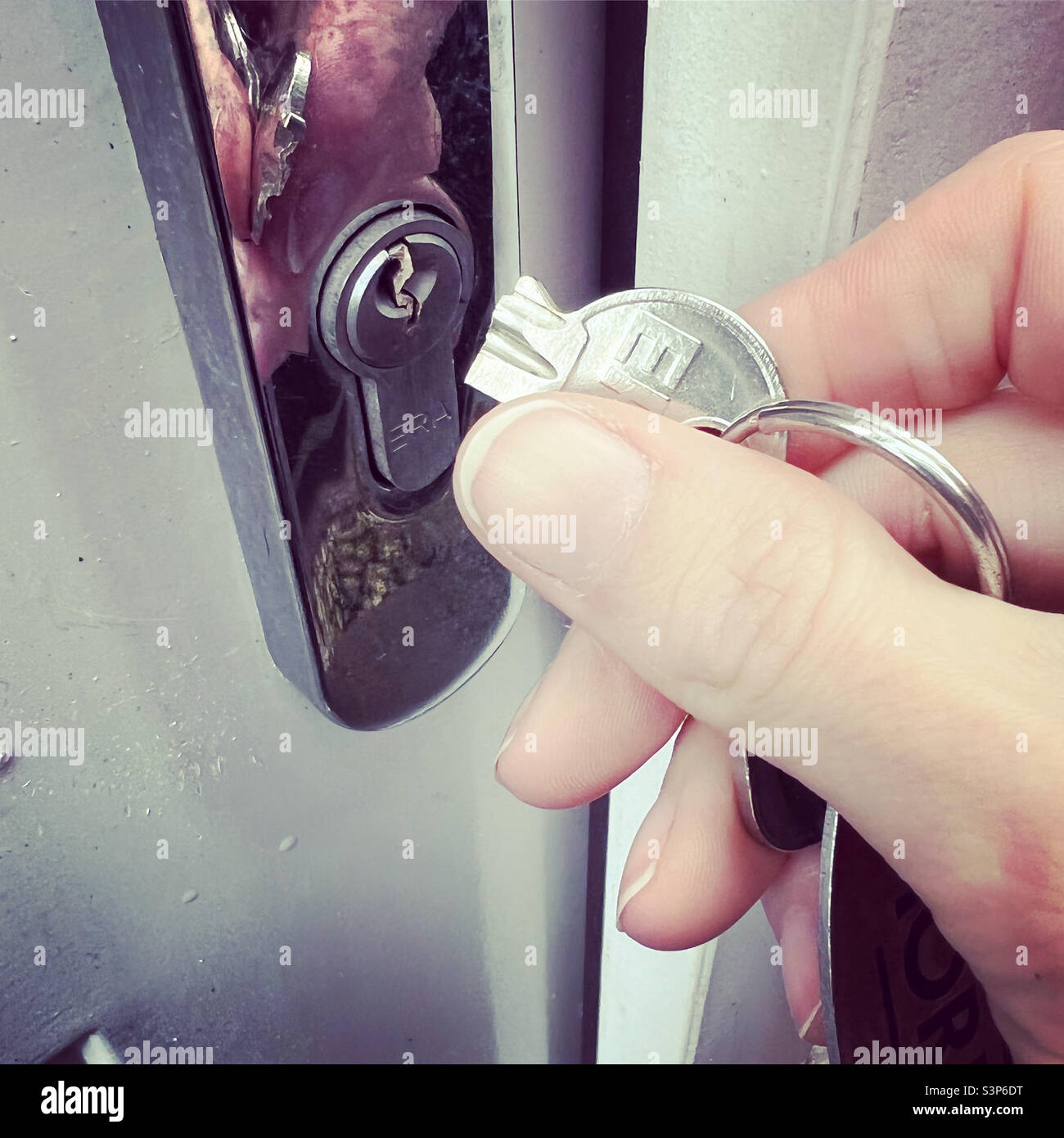 Broken key in door lock Stock Photo