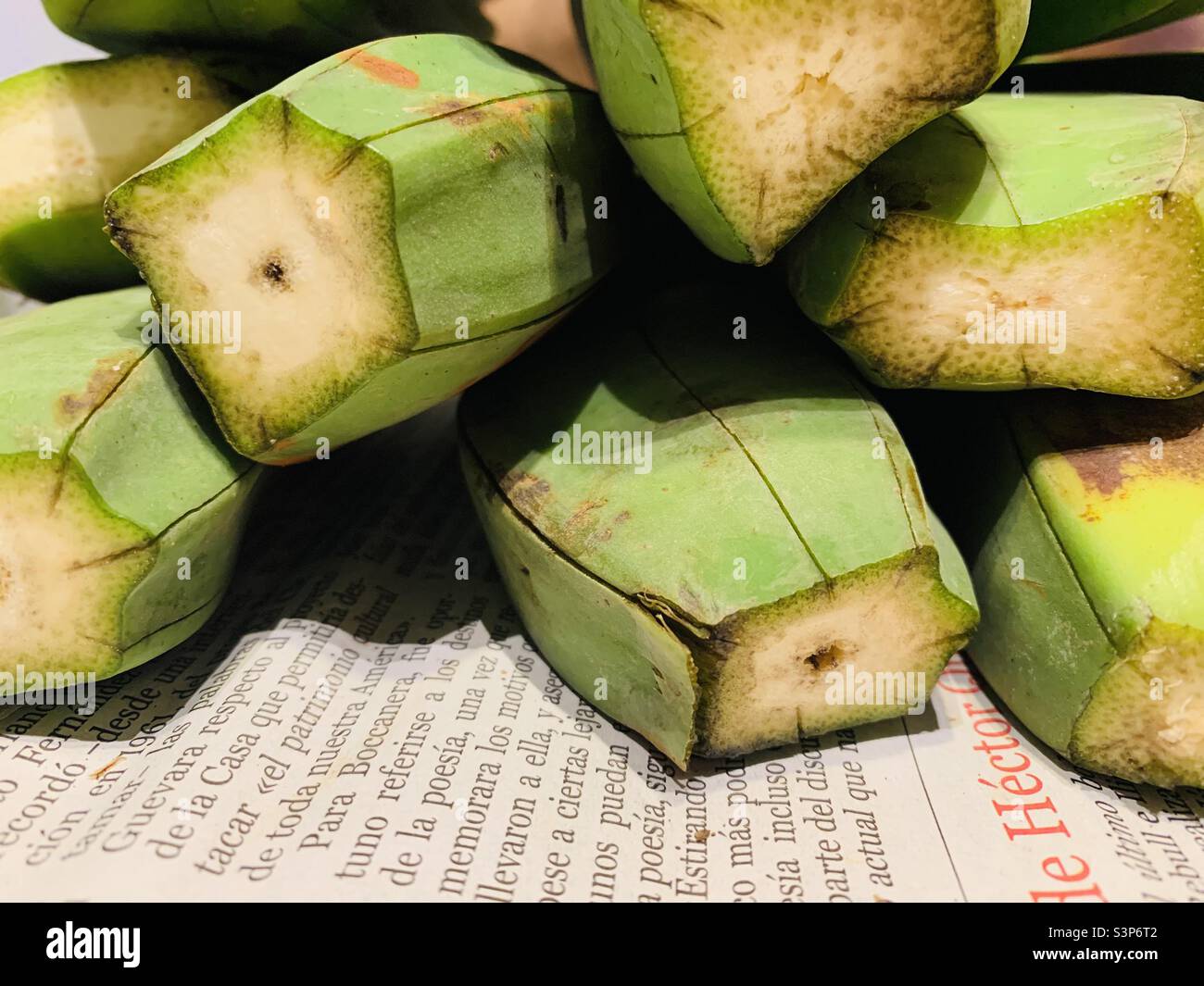 Plantains on a Cuban newspaper which is used to collect and wrap the peels. Havana, Cuba - Smartphone Captured Stock Image