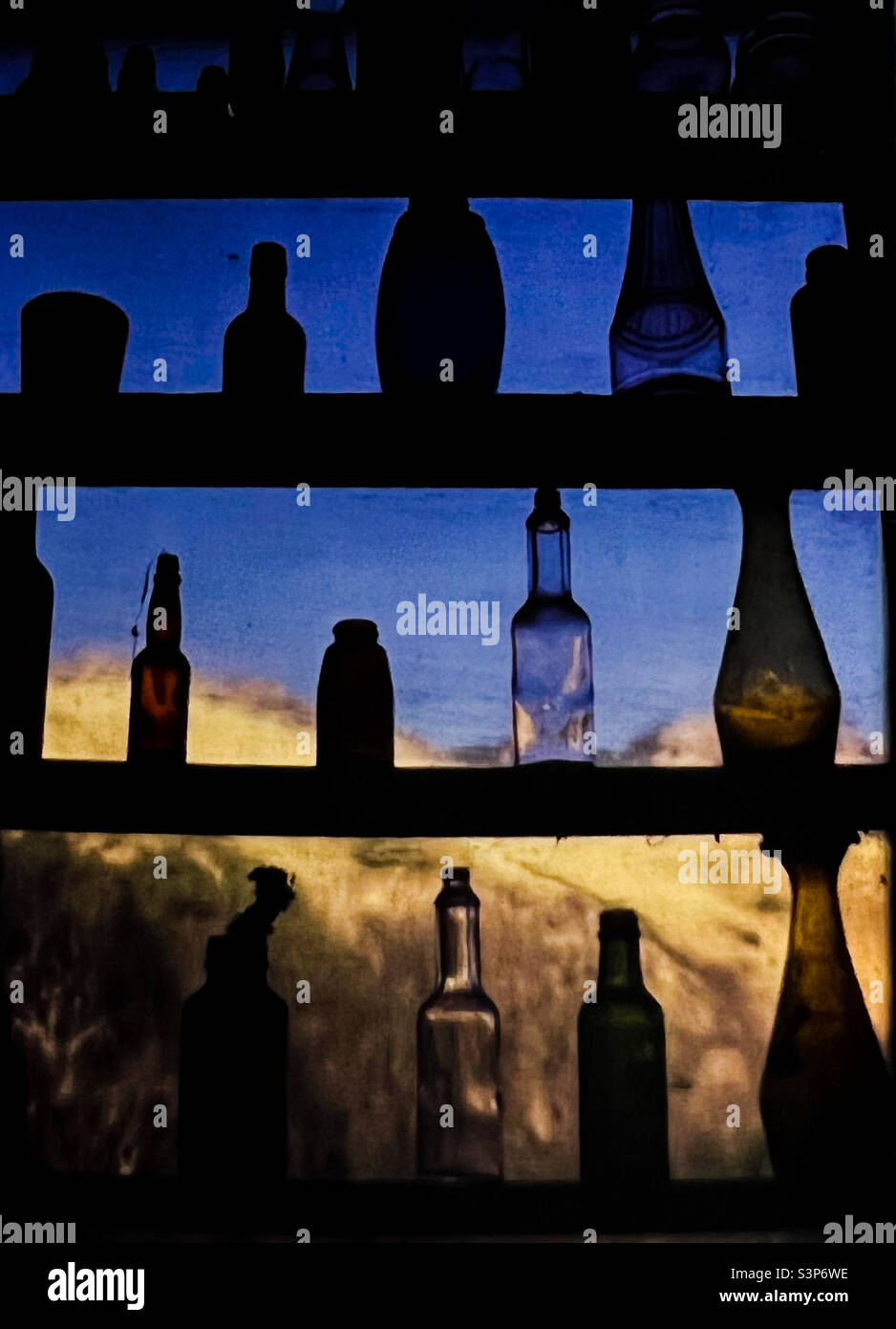 Antique Glass Bottles in window Northern California Route 1 Stock Photo