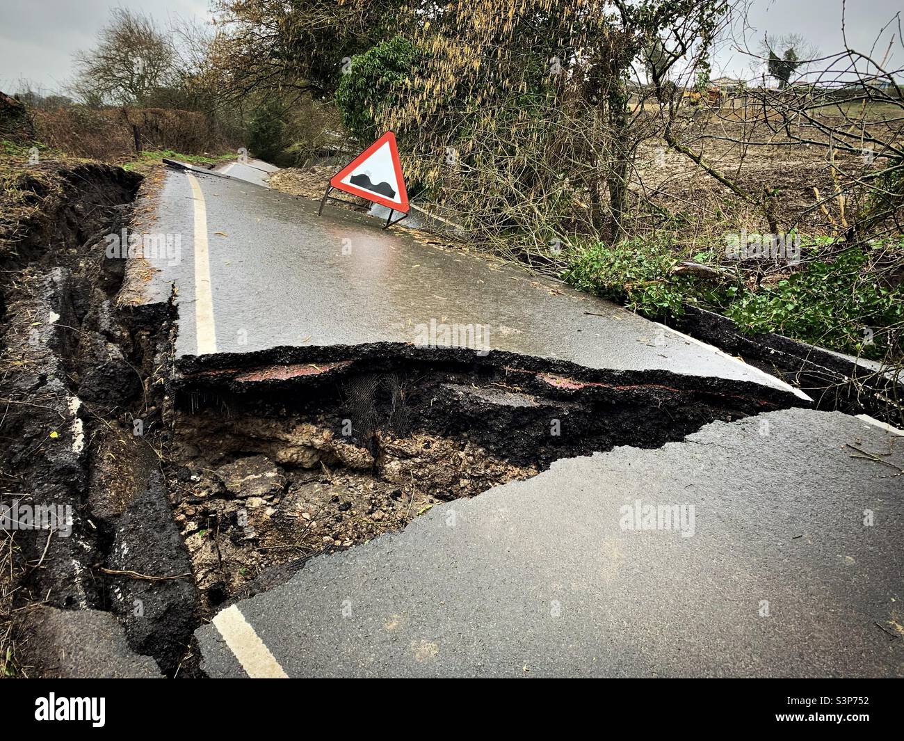 A warning sign seen on the B4069 road destroyed by a landslip near