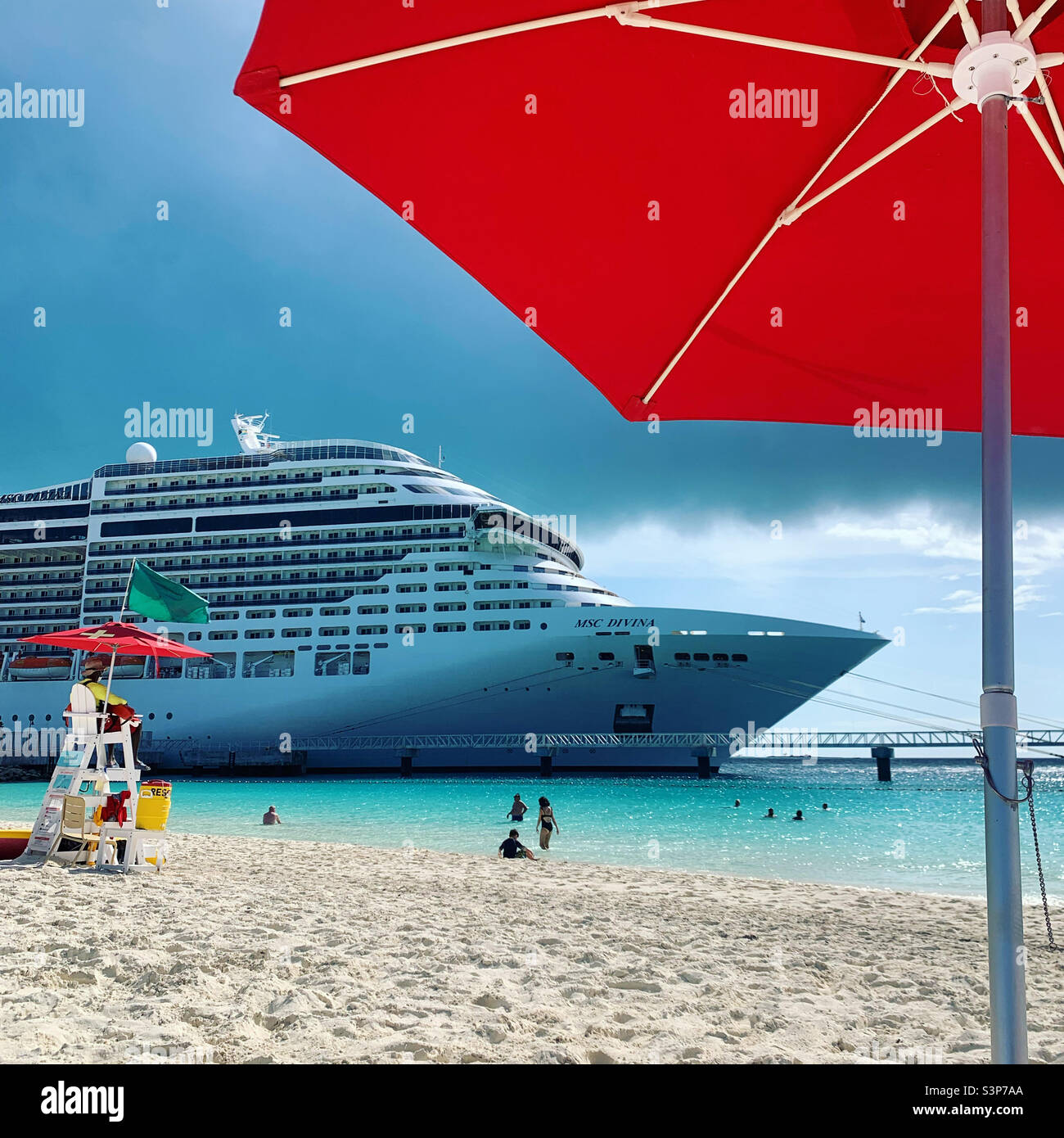 January, 2022, on the beach at Ocean Cay, private island of MSC cruise line, located in Bimini, The Bahamas, looking at the MSC Divina while on a cruise from Miami, Florida - Smartphone Captured Stock Image
