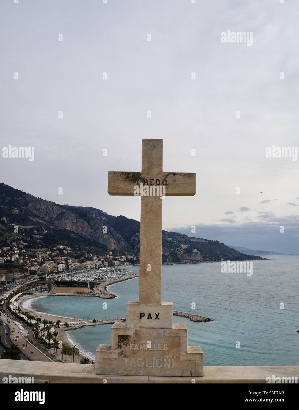A cross overlooking the new port and marina in Menton France. - Smartphone Captured Stock Image