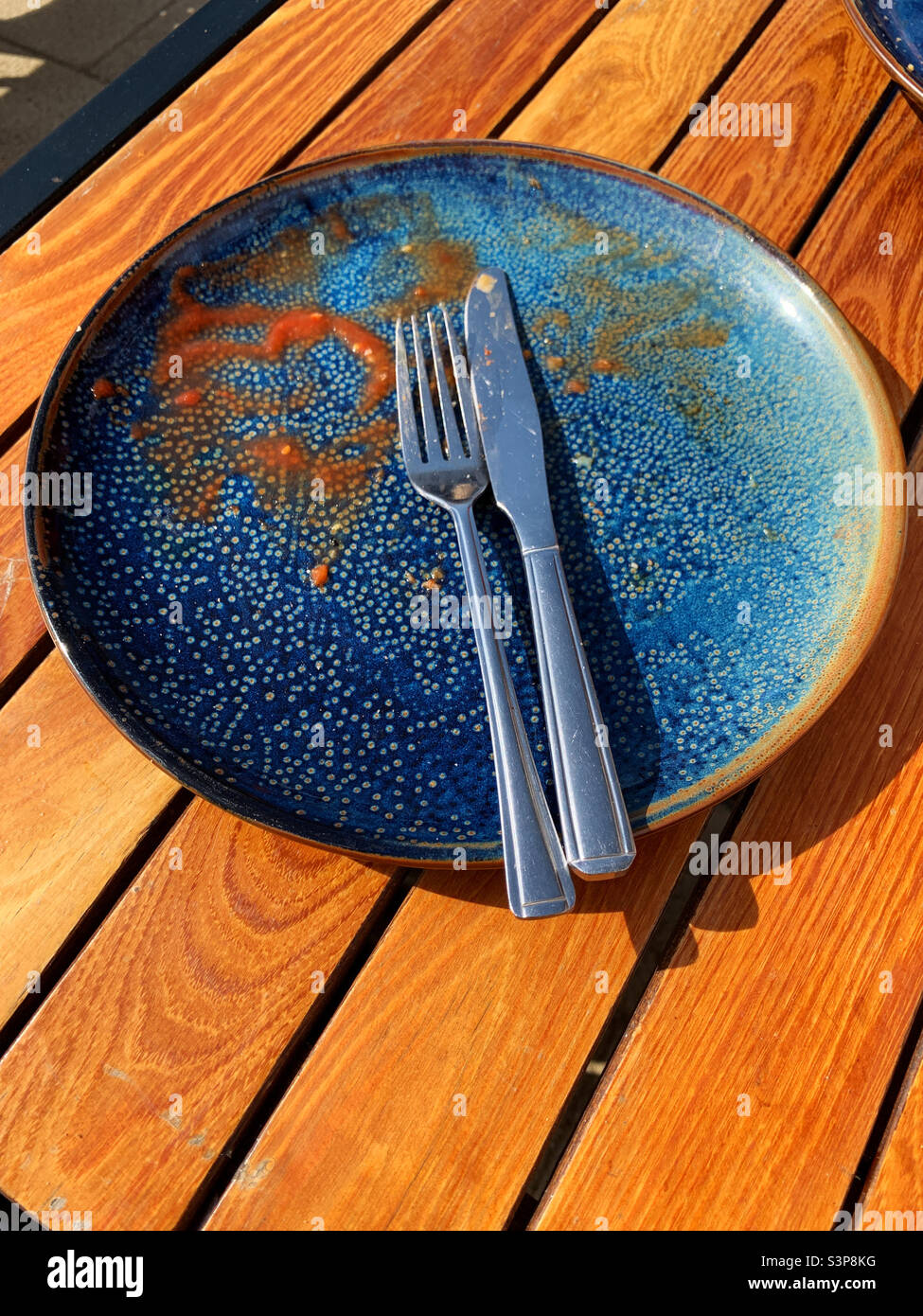 Empty plate after a traditional full English breakfast - Smartphone Captured Stock Image