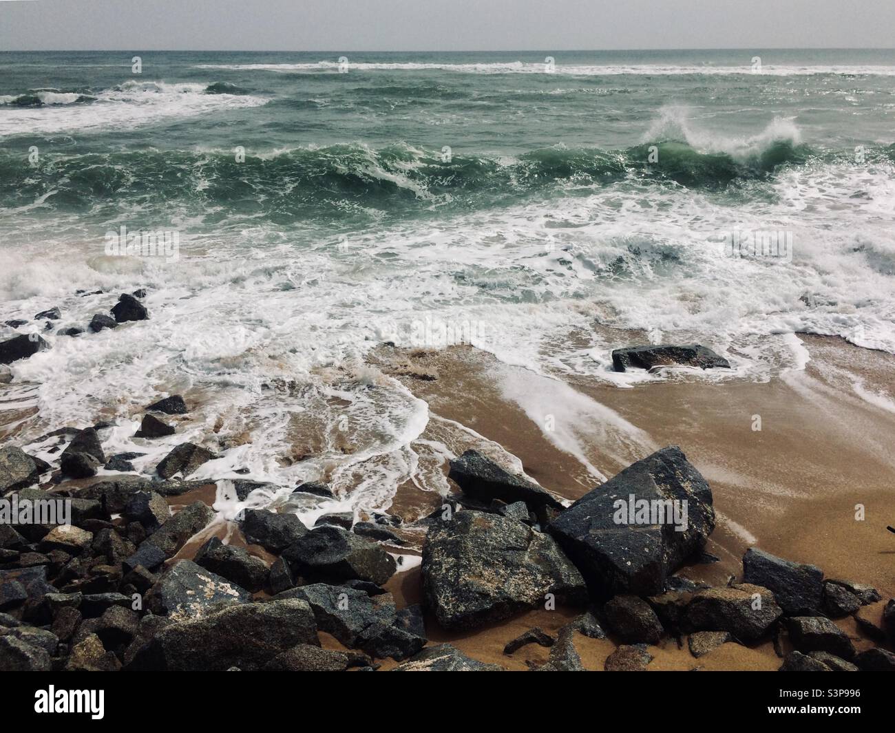 Waves breaking in rocky shore. Coastal erosion. Mediterranean Sea - Smartphone Captured Stock Image