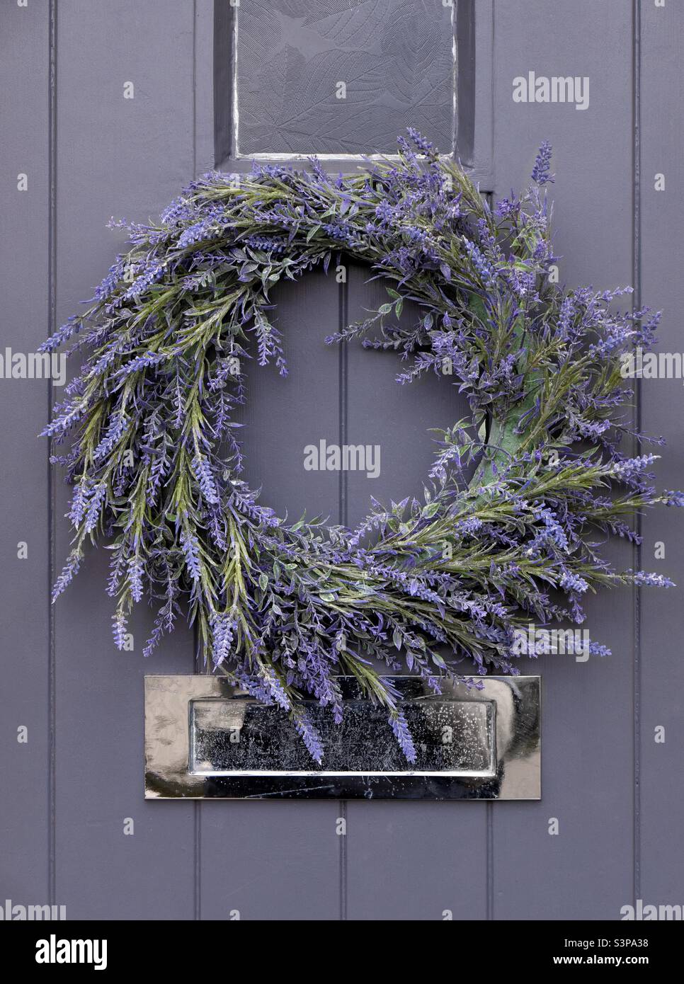 Lavender wreath on lavender coloured door - Smartphone Captured Stock Image