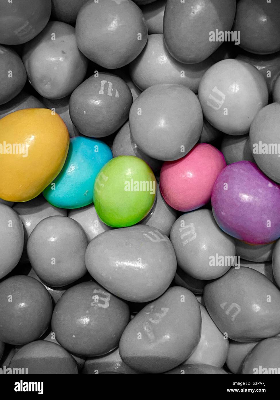 Select color(s) M&M chocolate-covered peanut candies, colored in pastels especially for Easter. - Smartphone Captured Stock Image