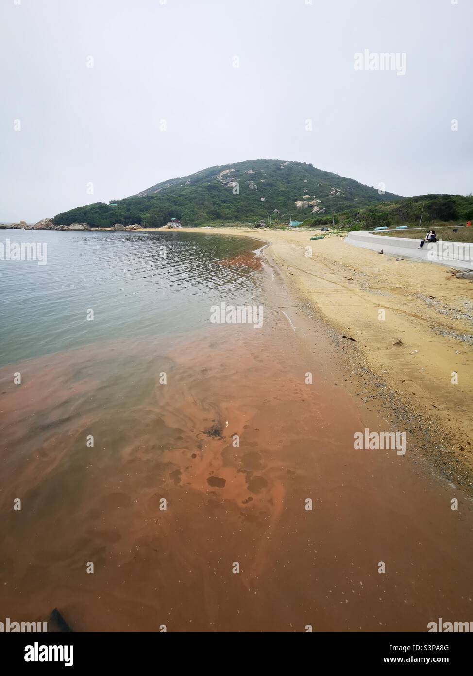 Red tide ( algal bloom ) along the beach of Shek Pai Wan on Lamma island in Hong Kong. Stock Photo