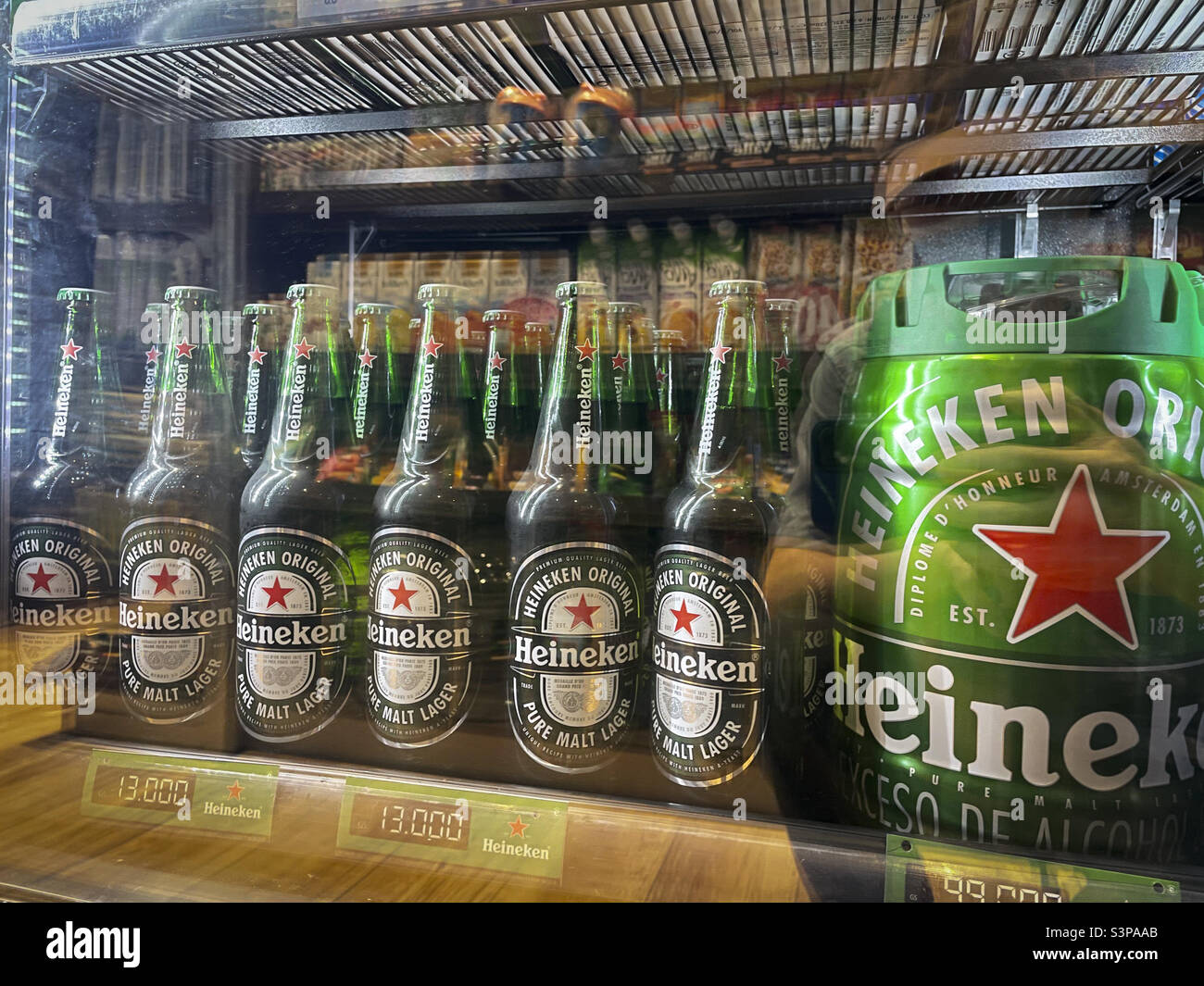 Heineken beer in the fridge displayed at a supermarket Stock Photo - Alamy