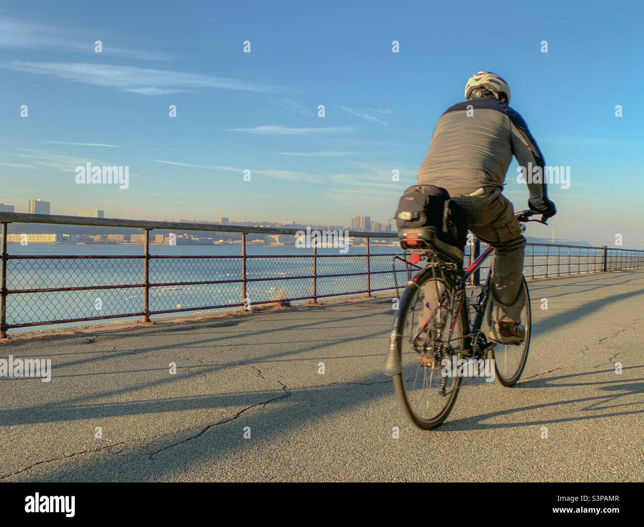 A man riding his bike at riverside park - Smartphone Captured Stock Image