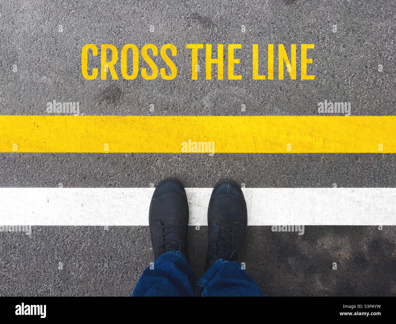 Cross the line message on asphalt road Stock Photo - Alamy