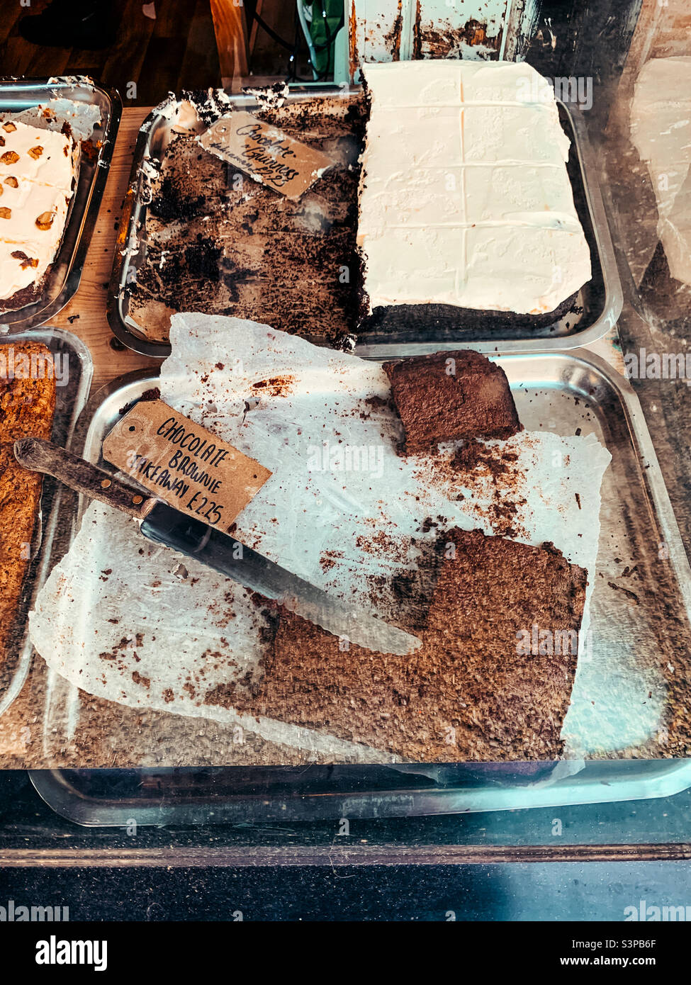 Chocolate brownie cakes in a shop window Stock Photo Alamy