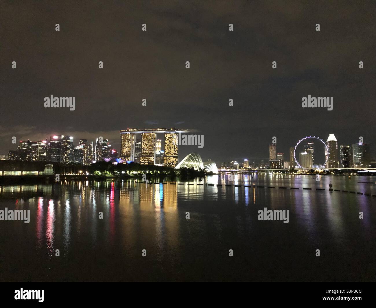 Singapore’s CBD and Marina Bay Sands come to life as evening settles. Stock Photo