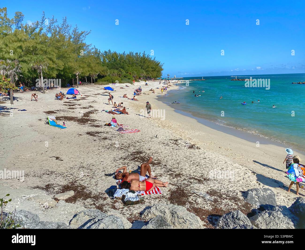 People on the beach in Fort Zachary Taylor State Park in Key West Florida Stock Photo