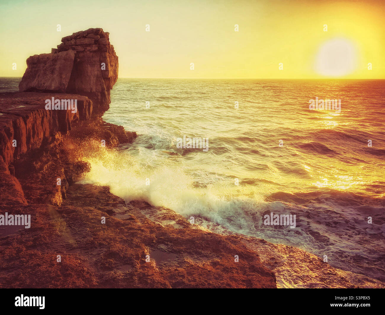 Sunset at Pulpit Rock. This famous location is on the Isle of Portland and very close to Portland Bill Lighthouse. Dorset, England, UK. Photo ©️ COLIN HOSKINS. - Smartphone Captured Stock Image