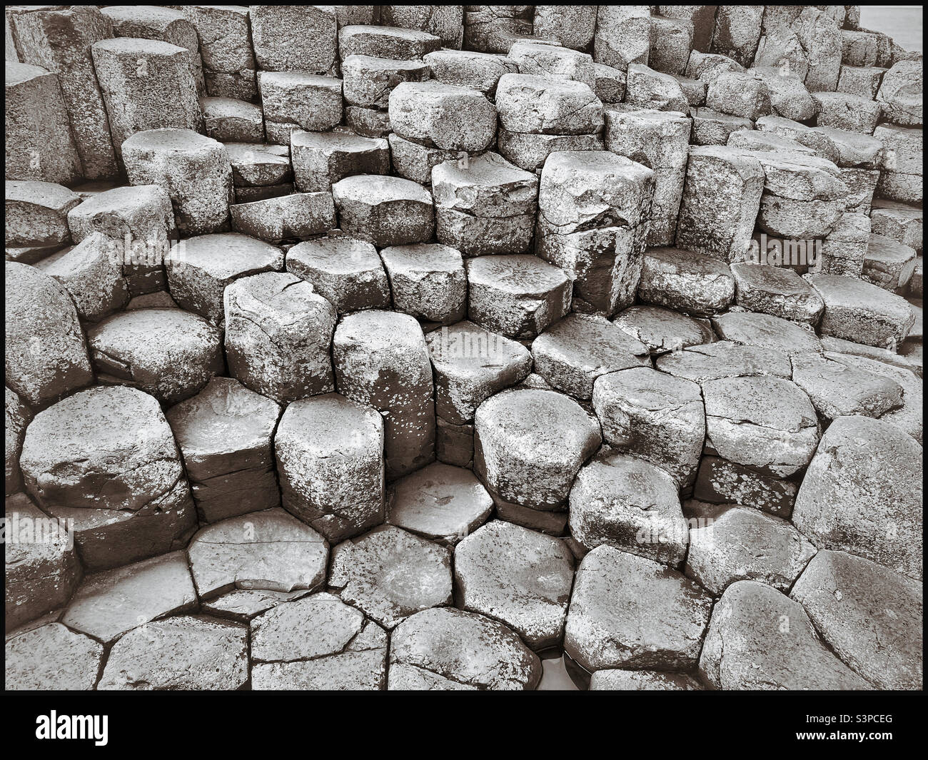 Giant’s Causeway in Northern Ireland, United Kingdom is a rare geological site, with interesting hexagonal shaped volcanic basalt columns creating a geological spectacle. Photo ©️ COLIN HOSKINS. - Smartphone Captured Stock Image
