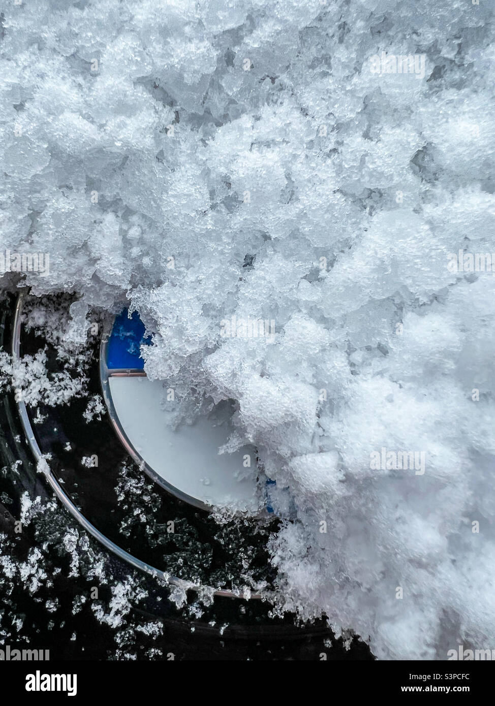 Snow covered BMW logo Stock Photo