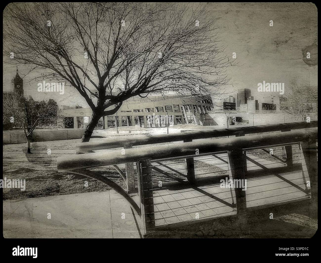 The SLC public library and City and County Building are seen in the background, with a walkway and bridge in a small city park is in the foreground. Vintage styling added digitally. - Smartphone Captured Stock Image