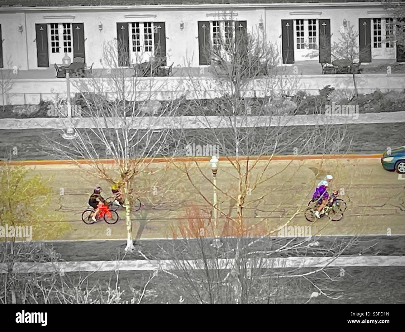 Looking down onto the main road thru Memory Grove Memorial Park in Salt Lake City people can be seen cycling and otherwise enjoying a beautiful spring day in Utah, USA. - Smartphone Captured Stock Image